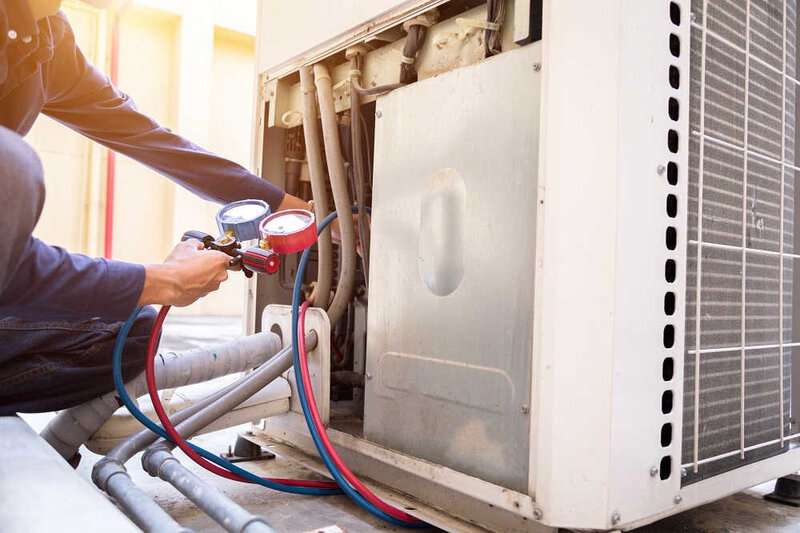 air conditioning maintenance being performed